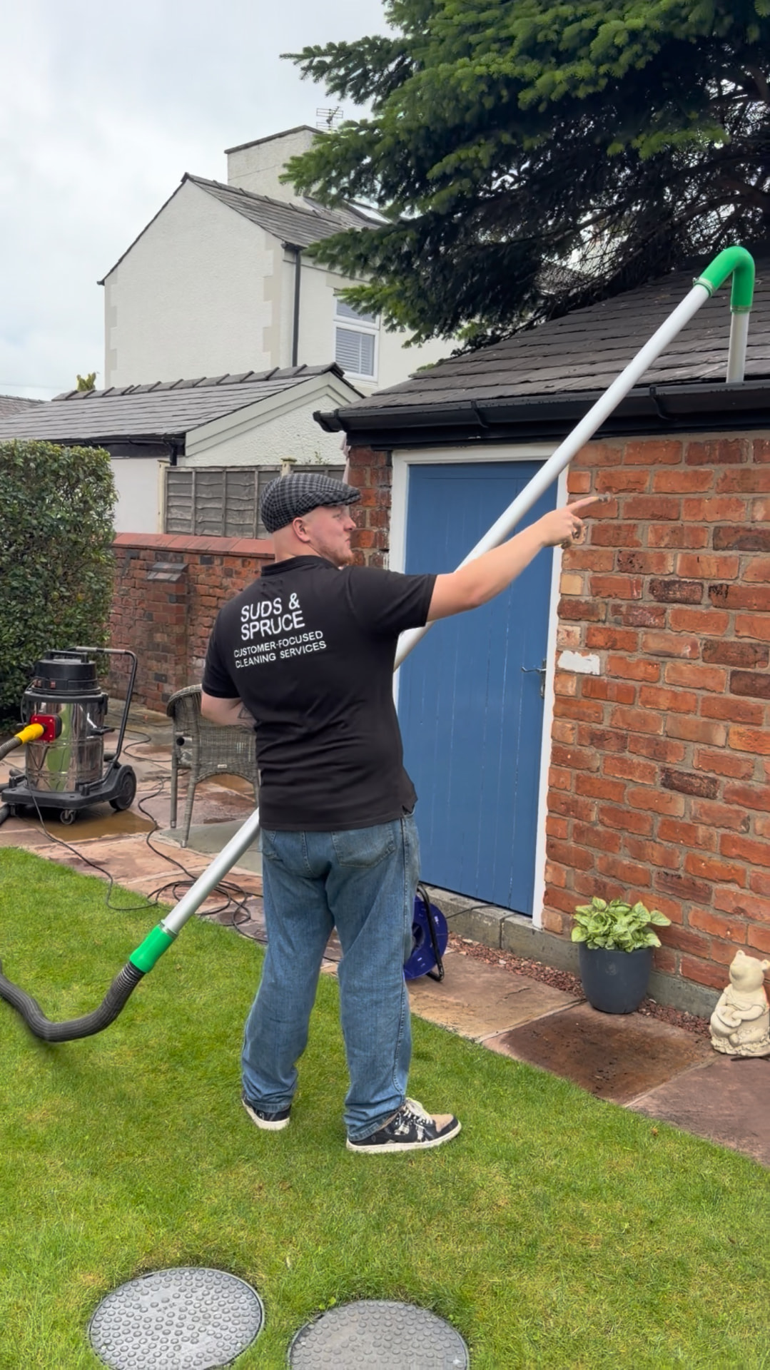 Suds & Spruce carrying out gutter cleaning with professional vacuum equipment